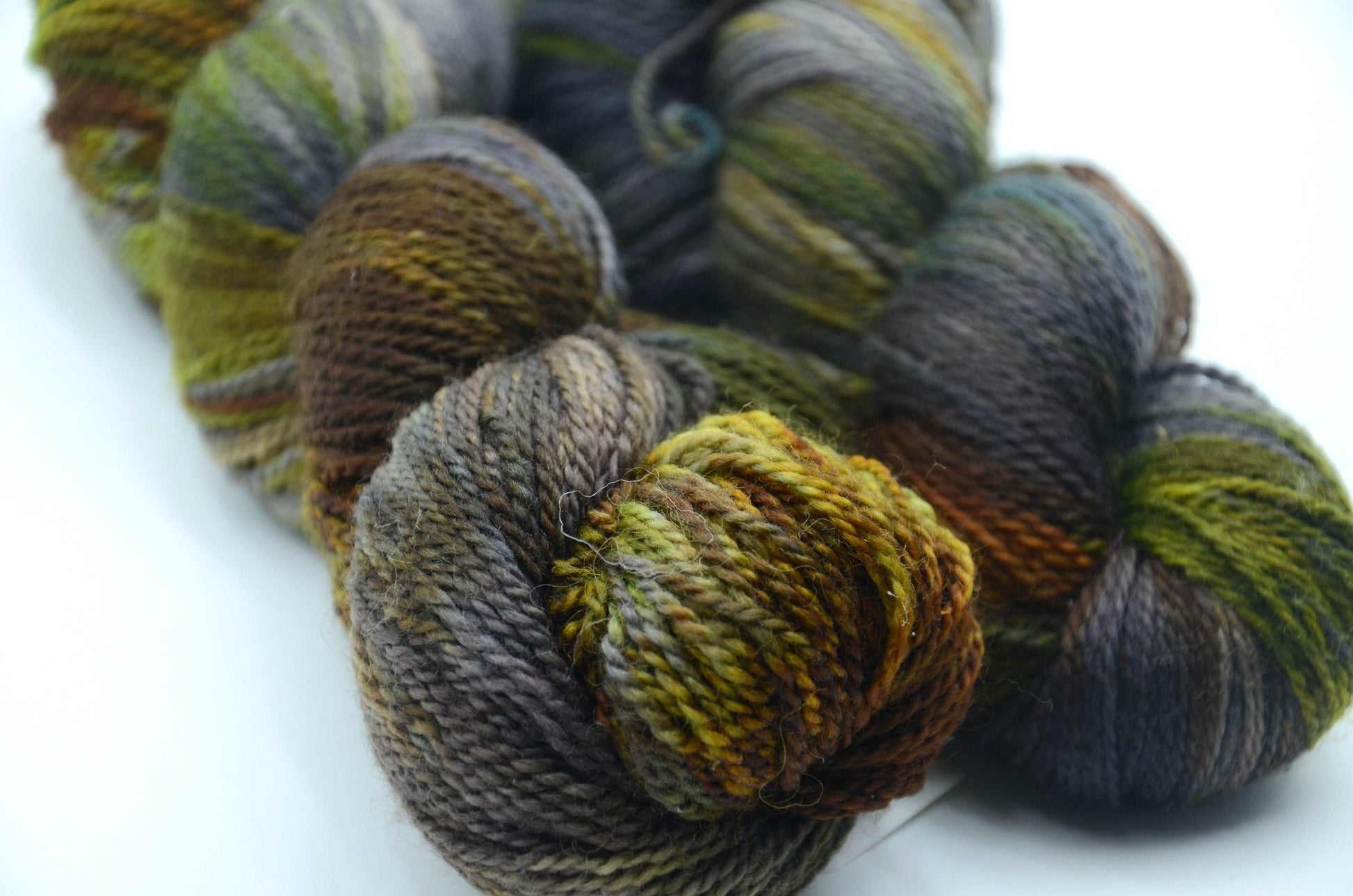 Hand-Dyed & Hand Painted Yarn with notes of green, blue, brown and gray