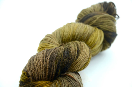 olive colored hand painted and hand dyed knitting yarn with notes of dark army green