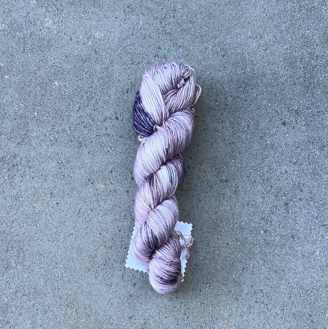 light purple and lavendar colored hand painted and hand dyed knitting yarn with notes of dark purple