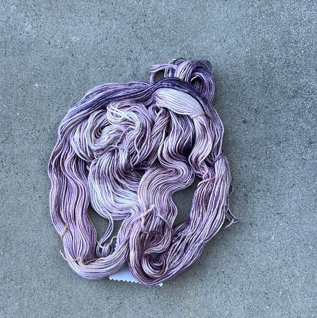 light purple and lavendar colored hand painted and hand dyed knitting yarn with notes of dark purple