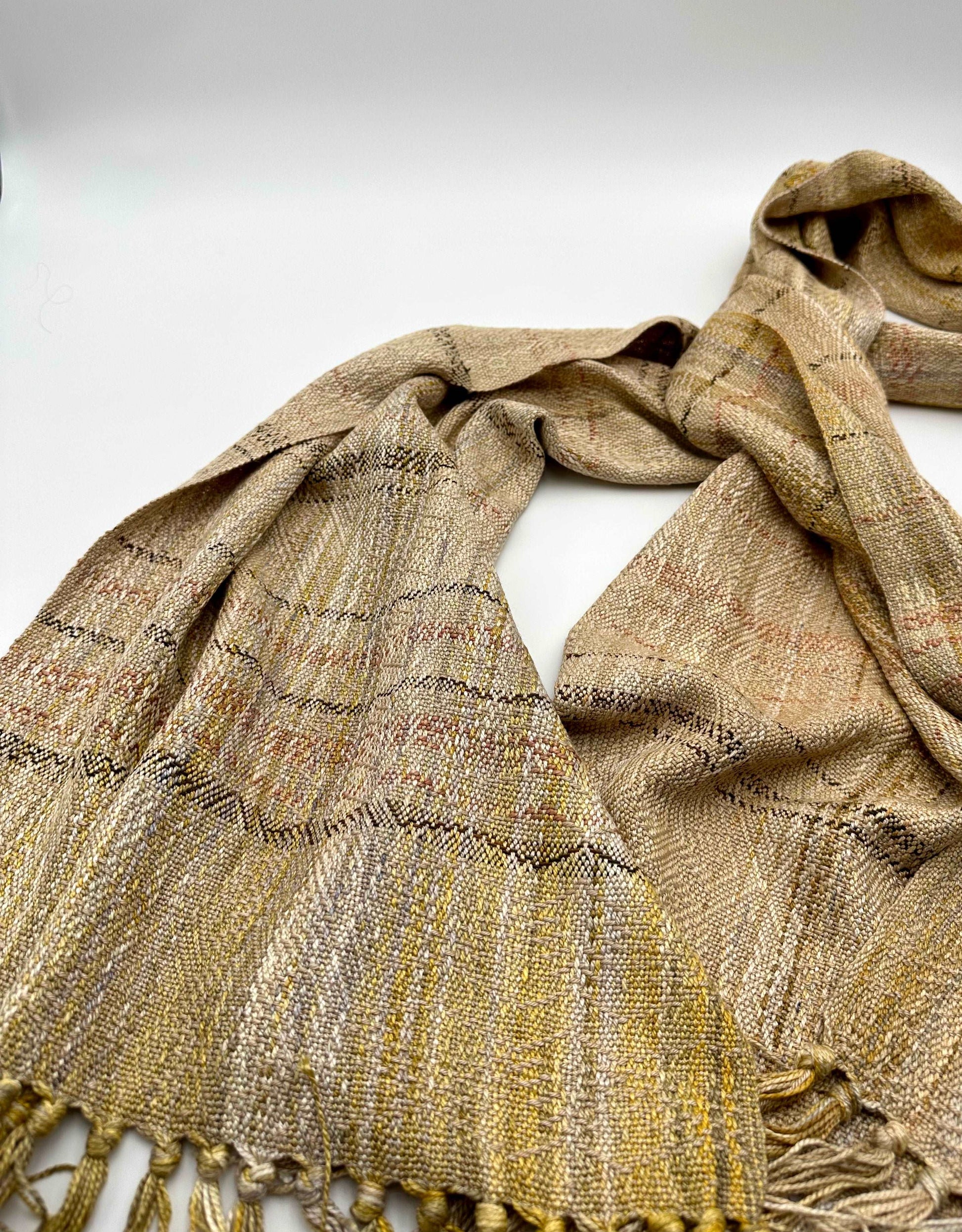 warm toned womens handwoven scarf with notes of golden yellow and dark red