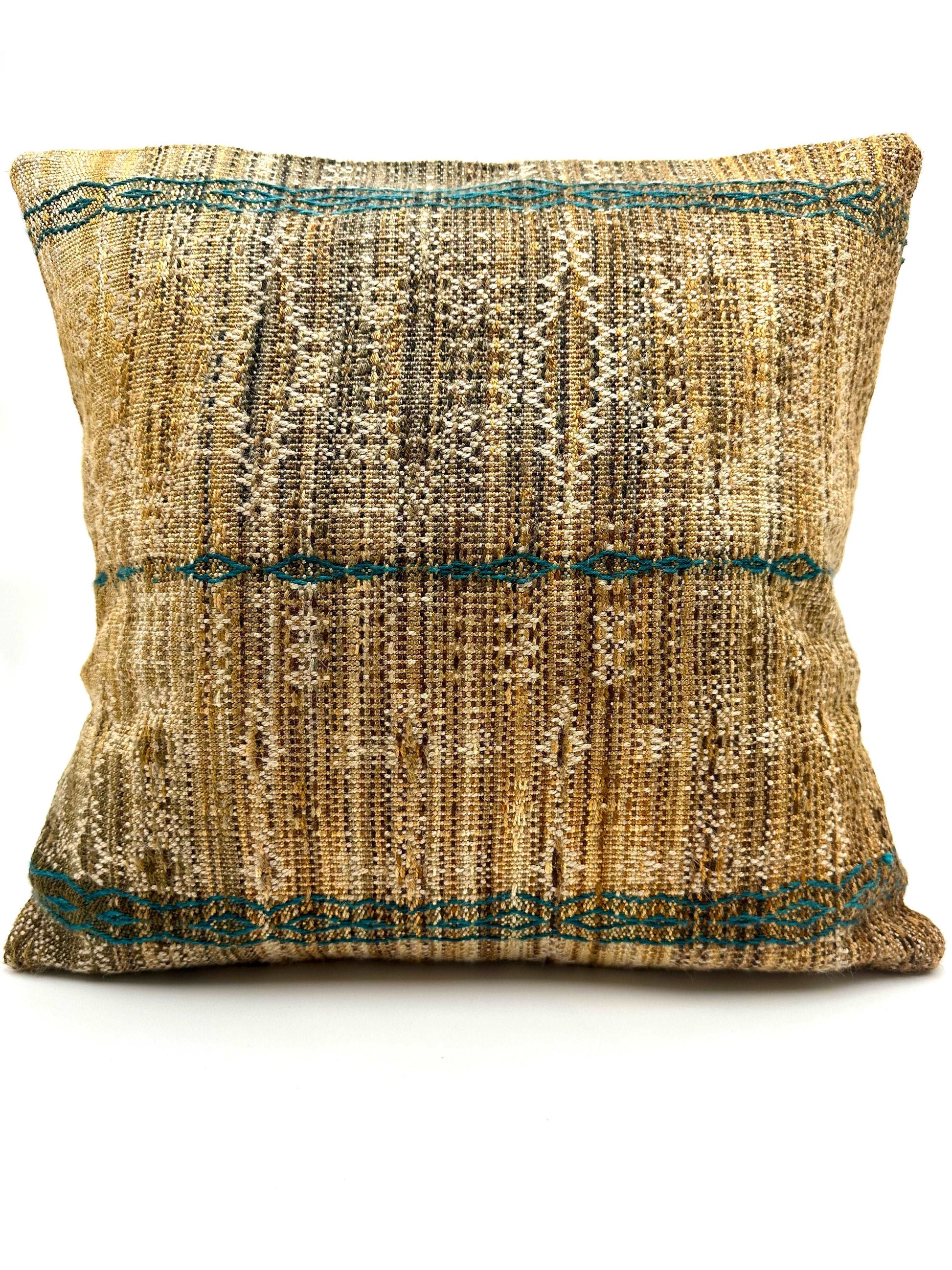 Neutral Warm Toned Handwoven throw pillow with turquoise detailing