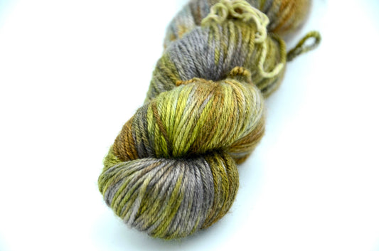 hand dyed and hand painted knitting yarn tones of light green and gold